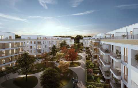 Moderne Wohnanlage mit vierstöckigen Gebäuden und begrüntem Innenhof.