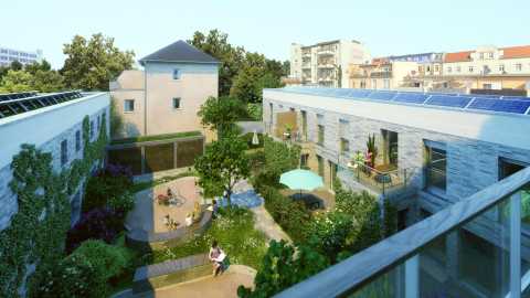 Innenhof mit Spielplatz, Sitzbänken, Bäumen und modernen Wohngebäuden.