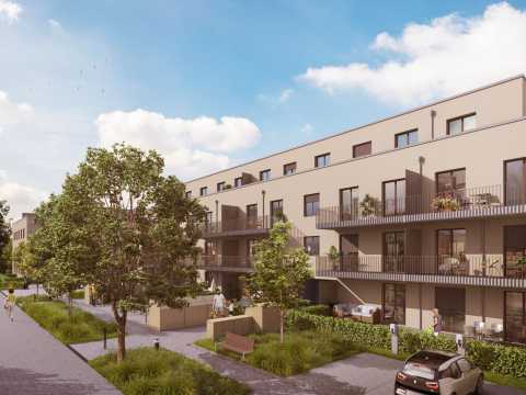 Moderne Wohnanlage mit Balkonen, Bäumen und geparktem Auto an sonnigem Tag.