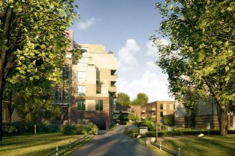 Moderne Wohngebäude umgeben von grünen Bäumen und gepflegten Gärten.