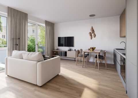 Helles Wohnzimmer mit Sofa, Esstisch, Küche und großen Fenstern zur Terrasse.