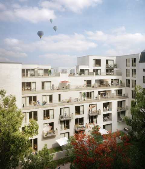 Modernes Wohnhaus mit Balkonen, Bäumen davor und Heißluftballons am Himmel.